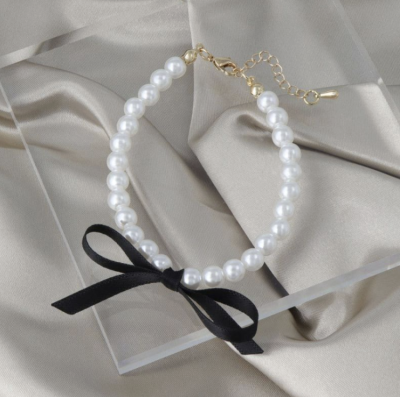 Vòng tay Osewaya ngọc trai đính nơ 99BL0542